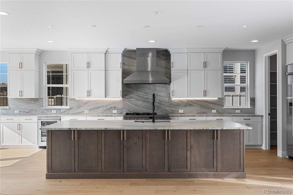 Interior, Kitchen, Marble Walls, Recessed Lighting, Stainless Steel Appliances, Wood Texture Flooring