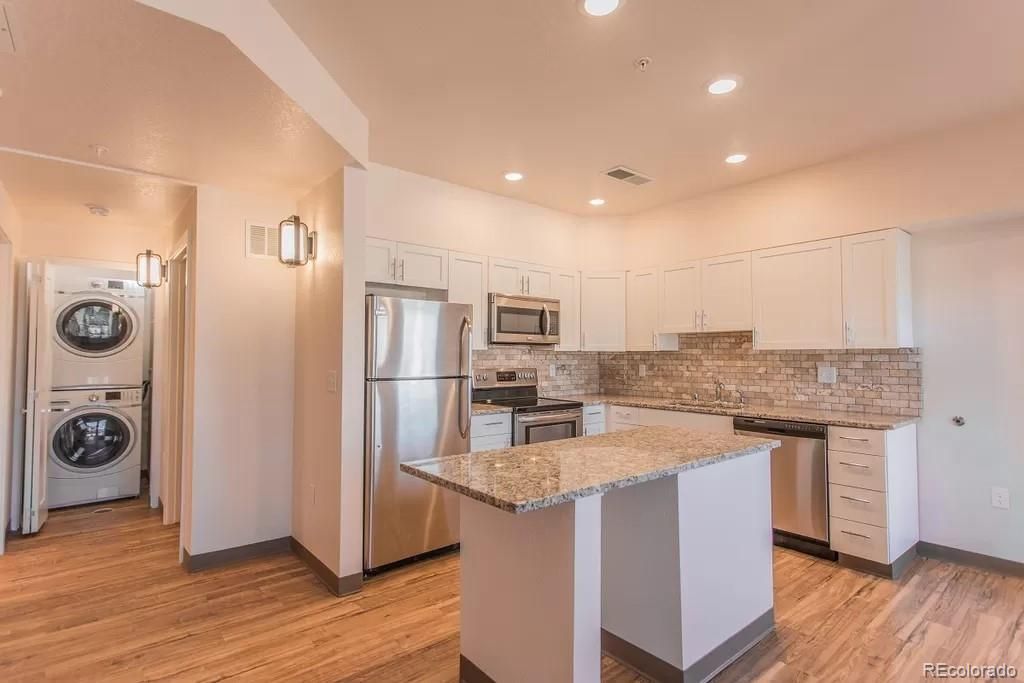 Interior, Kitchen, Recessed Lighting, Stainless Steel Appliances, Washer, Wood Texture Flooring