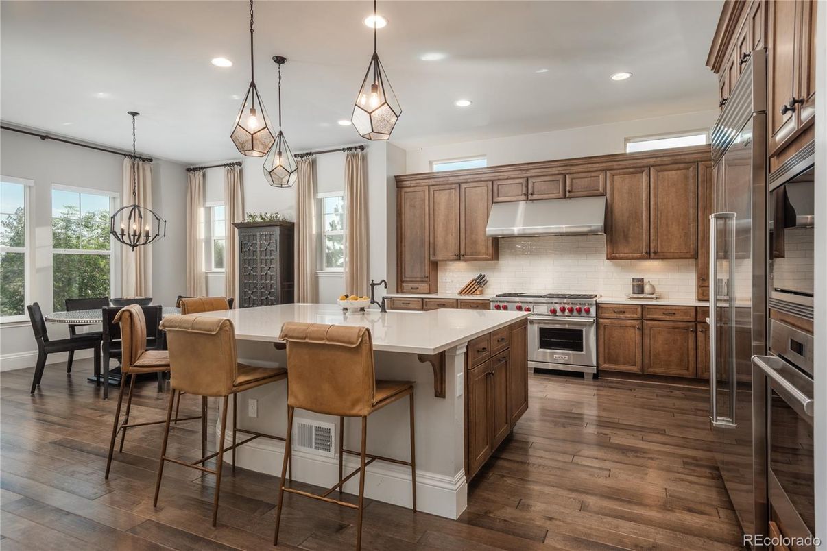 Dining room, Interior, Kitchen, Pendant Lights, Recessed Lighting, Stainless Steel Appliances, Wood Texture Flooring