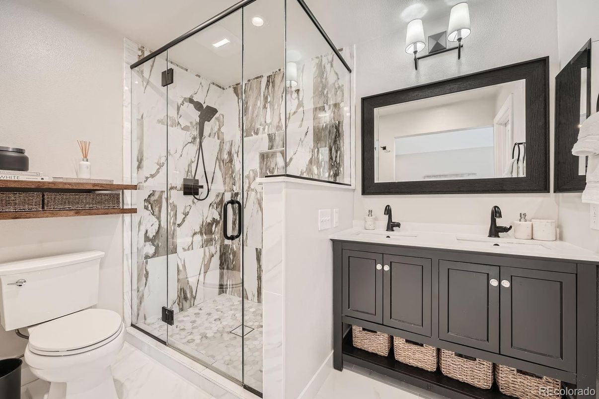 Bathroom, Dual Sink Vanities, Glass Shower, Interior, Marble, Marble Walls, Recessed Lighting