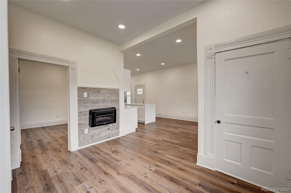 Empty room, Fireplace, Interior, Recessed Lighting, Wood Texture Flooring