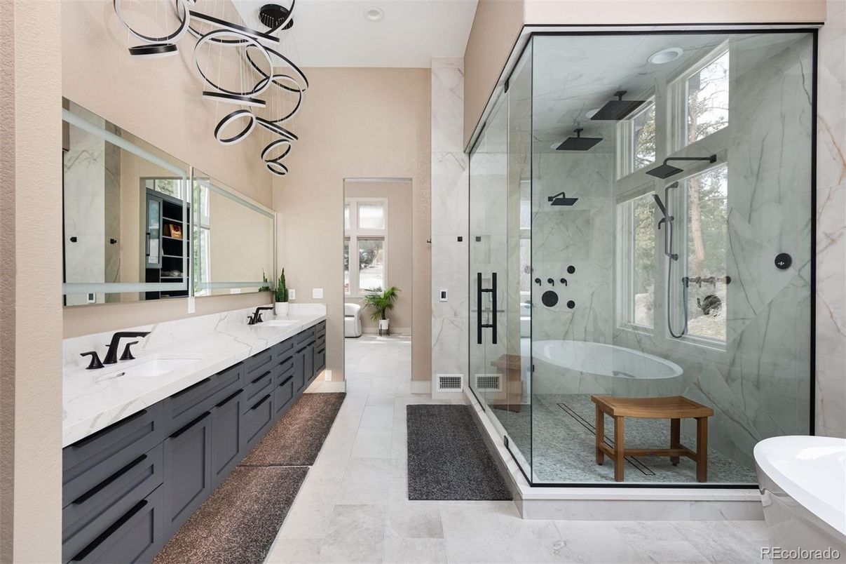 Bathroom, Dual Sink Vanities, Glass Shower, Interior, Marble, Marble Walls, Pendant Lights, Recessed Lighting