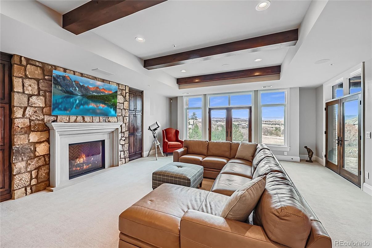 Fireplace, Fitness Equipment, Interior, Living room, Recessed Lighting, Stone Walls, Wooden Beams