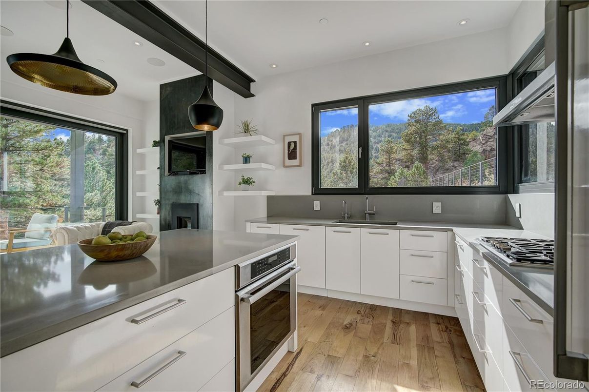 Fireplace, Interior, Kitchen, Pendant Lights, Recessed Lighting, Stainless Steel Appliances, Wood Texture Flooring
