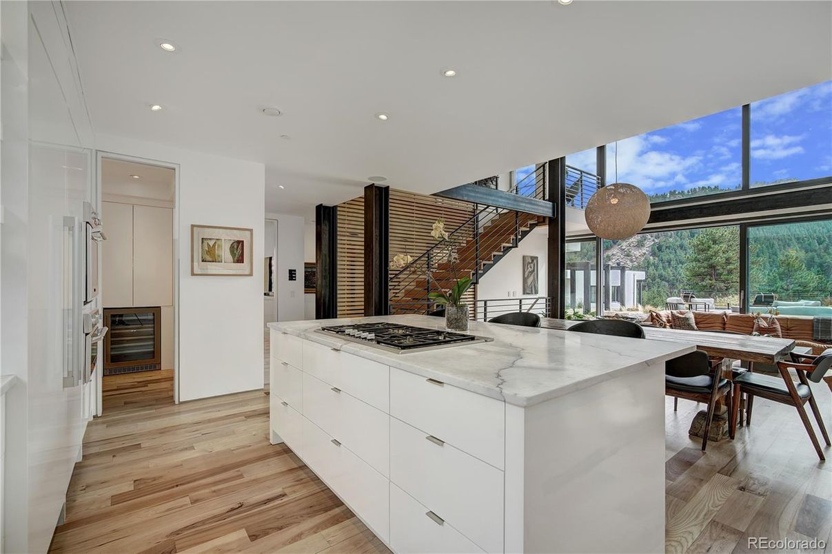 Dining room, Interior, Kitchen, Pendant Lights, Recessed Lighting, Stainless Steel Appliances, Wood Texture Flooring