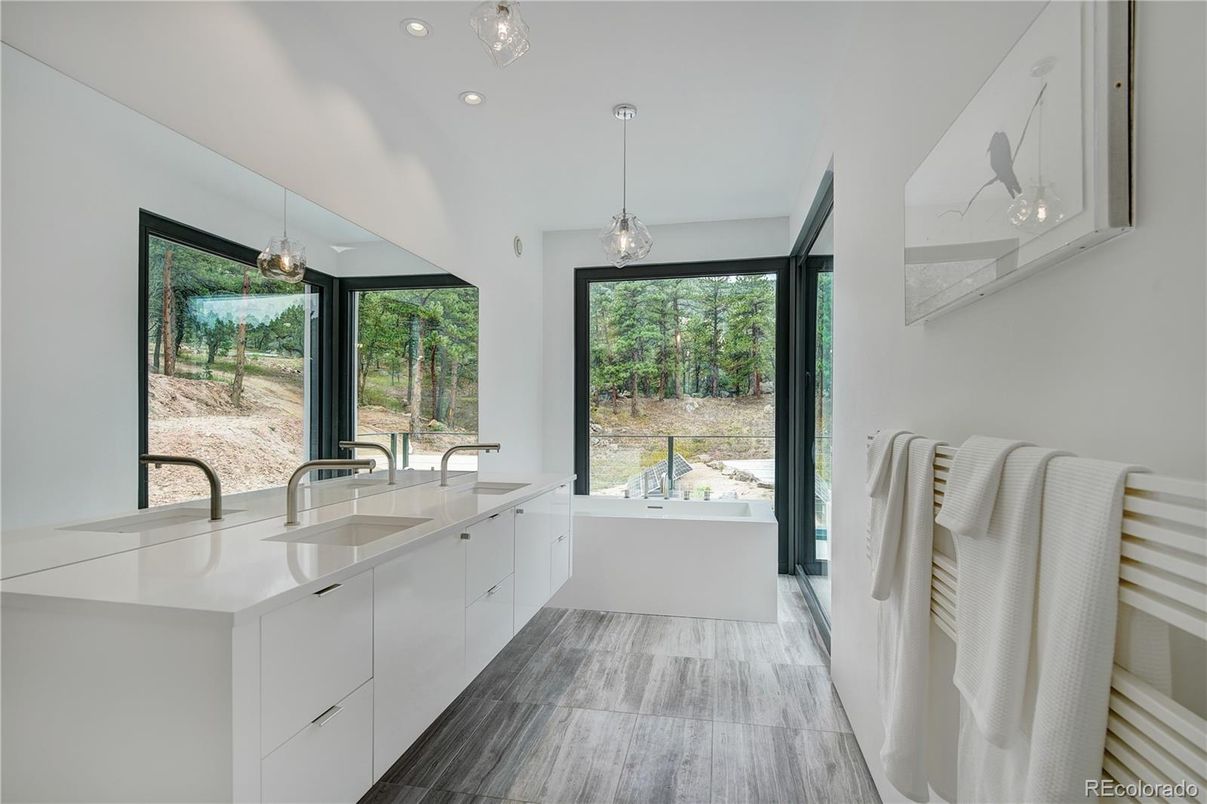 Bathroom, Dual Sink Vanities, Free Standing Baths, Interior, Pendant Lights, Recessed Lighting, Wood Texture Flooring