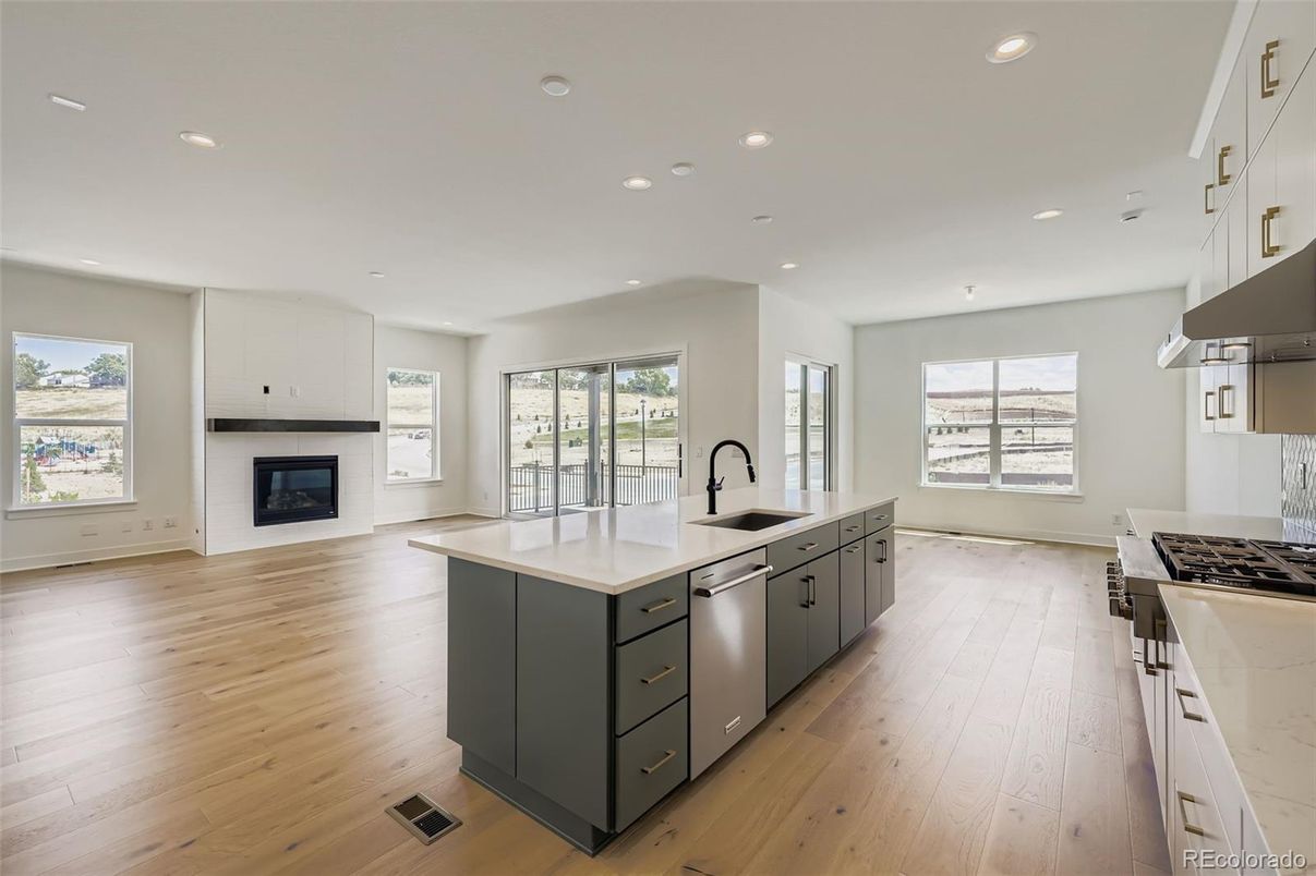 Fireplace, Interior, Kitchen, Recessed Lighting, Wood Texture Flooring