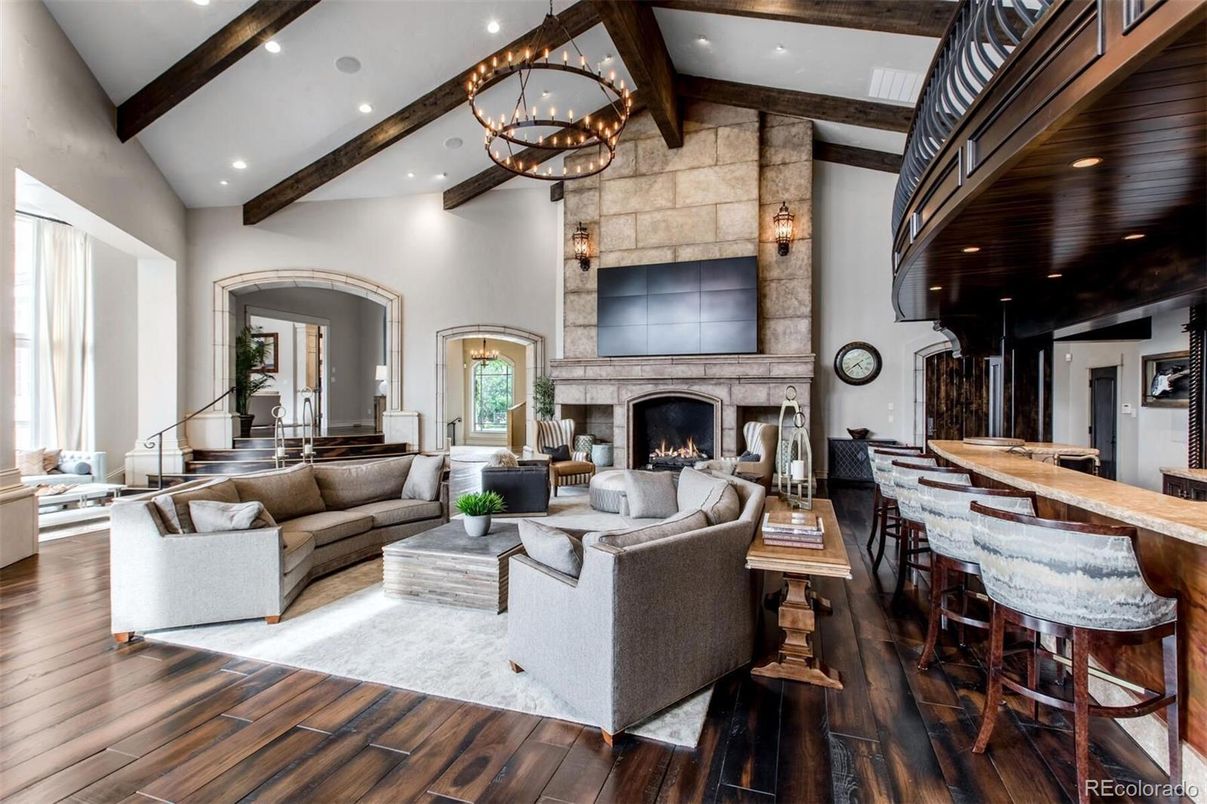 Chandelier, Dining room, Fireplace, Interior, Living room, Recessed Lighting, Stone Walls, Wooden Beams, Wood Texture Flooring