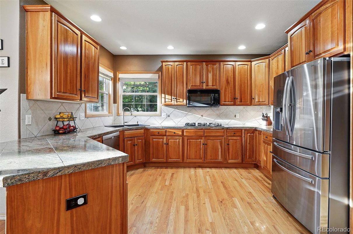 Interior, Kitchen, Recessed Lighting, Tile Countertops, Wood Texture Flooring