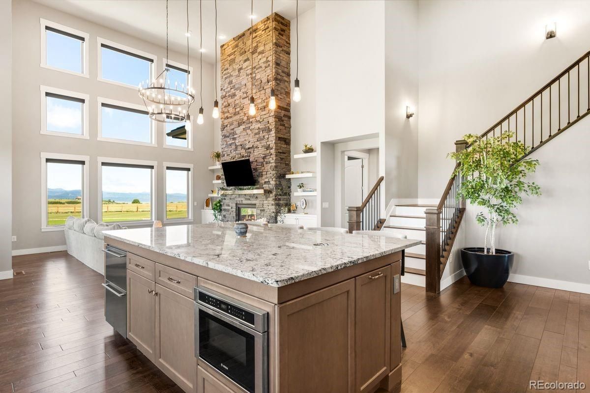 Fireplace, Interior, Kitchen, Pendant Lights, Stone Walls, Water, Wood Texture Flooring