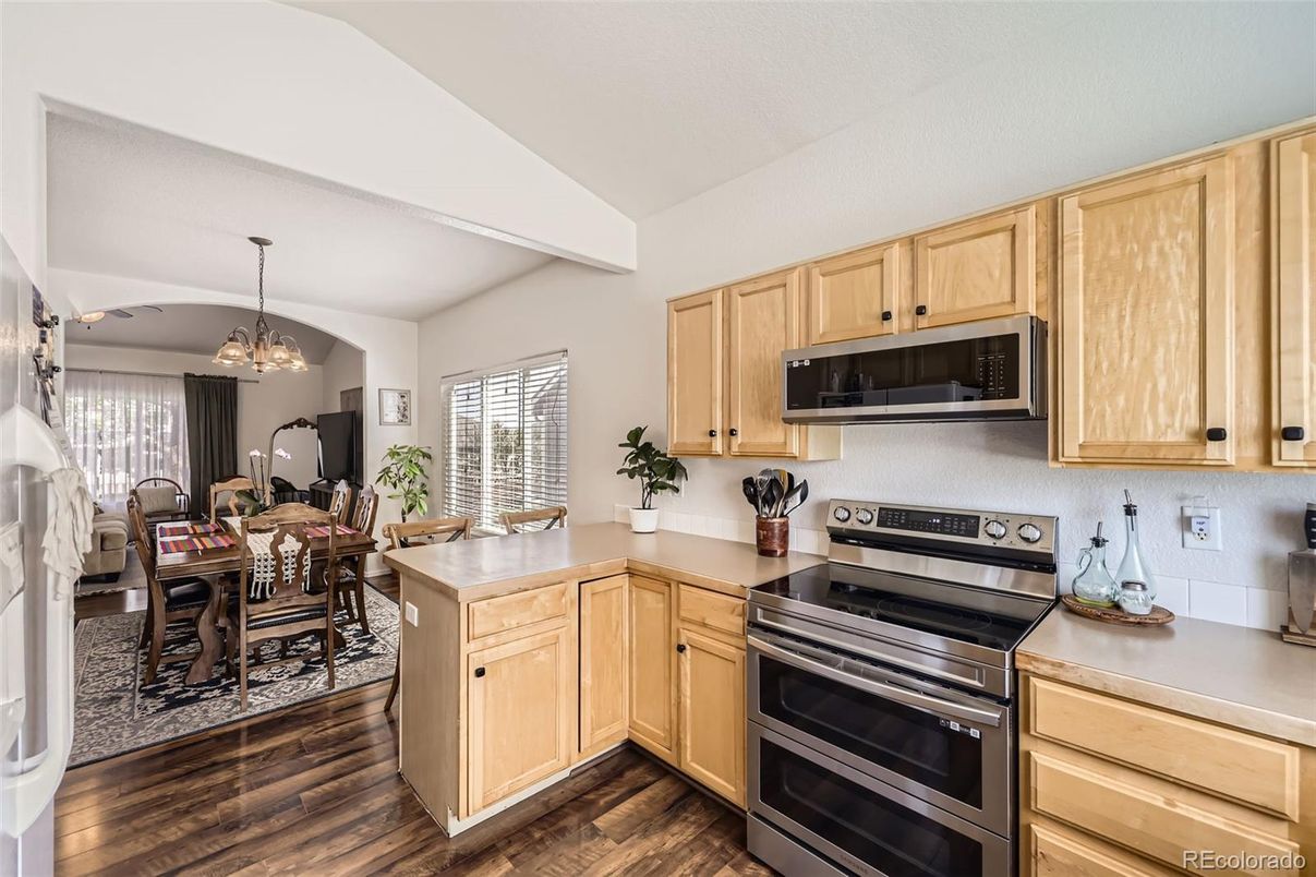 Chandelier, Dining room, Interior, Kitchen, Stainless Steel Appliances, Wood Texture Flooring