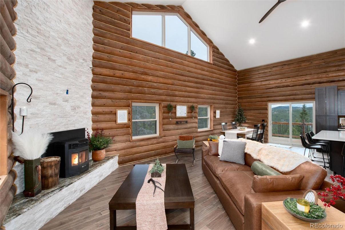 Dining room, Fireplace, Interior, Living room, Recessed Lighting, Stone Walls, Wood Texture Flooring, Wooden Walls