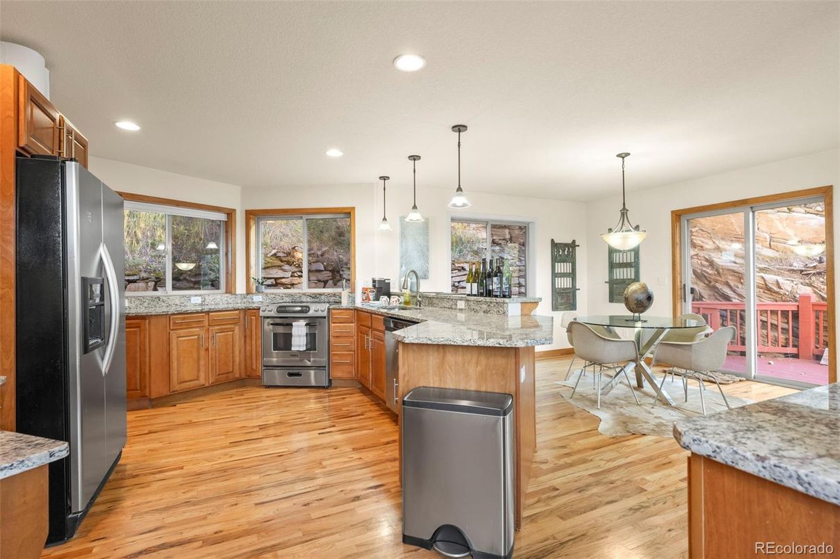 Dining room, Interior, Kitchen, Pendant Lights, Recessed Lighting, Stainless Steel Appliances, Wood Texture Flooring