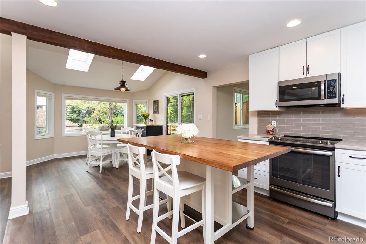 Dining room, Interior, Kitchen, Pendant Lights, Recessed Lighting, Stainless Steel Appliances, Wooden Beams, Wood Texture Flooring