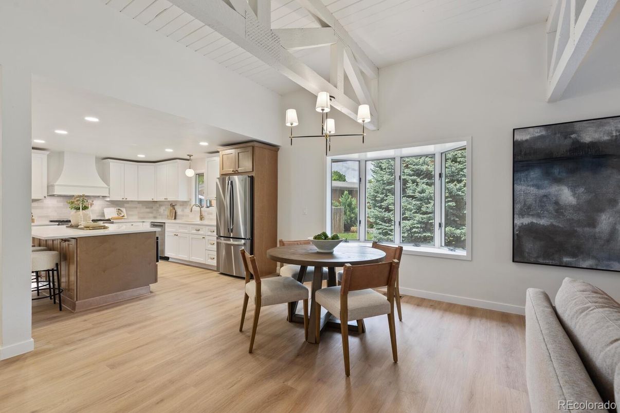 Chandelier, Dining room, Interior, Kitchen, Recessed Lighting, Stainless Steel Appliances, Wood Texture Flooring
