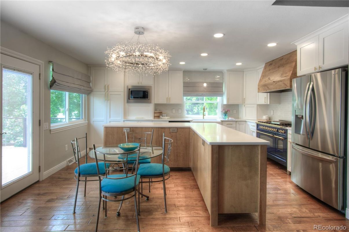 Chandelier, Dining room, Interior, Kitchen, Recessed Lighting, Stainless Steel Appliances, Wood Texture Flooring