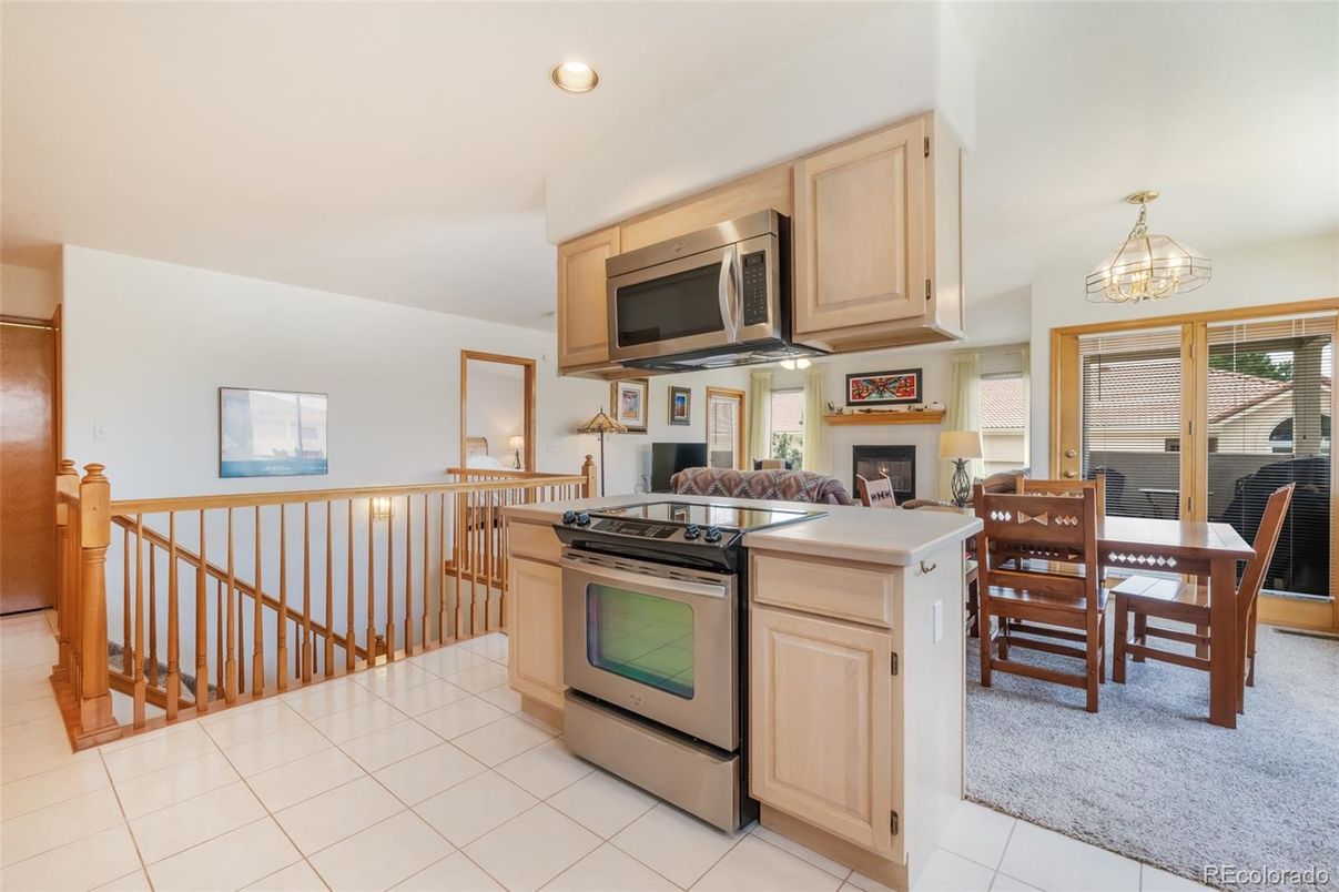 Dining room, Fireplace, Interior, Kitchen, Recessed Lighting, Stainless Steel Appliances
