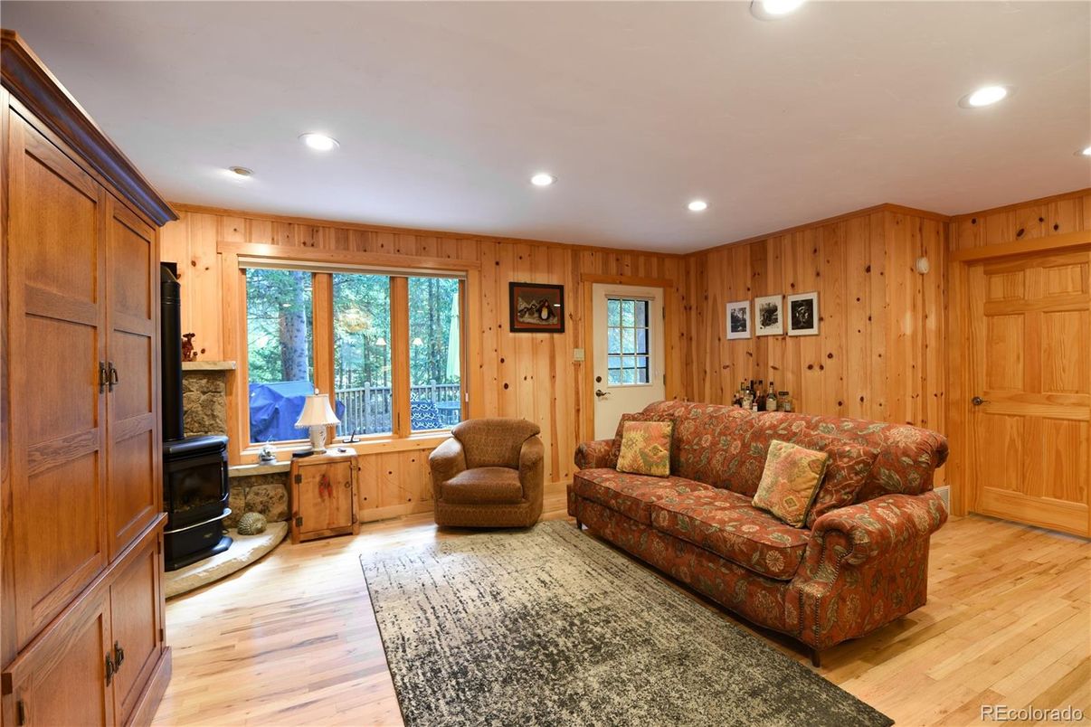 Fireplace, Interior, Living room, Recessed Lighting, Wood Texture Flooring, Wooden Walls