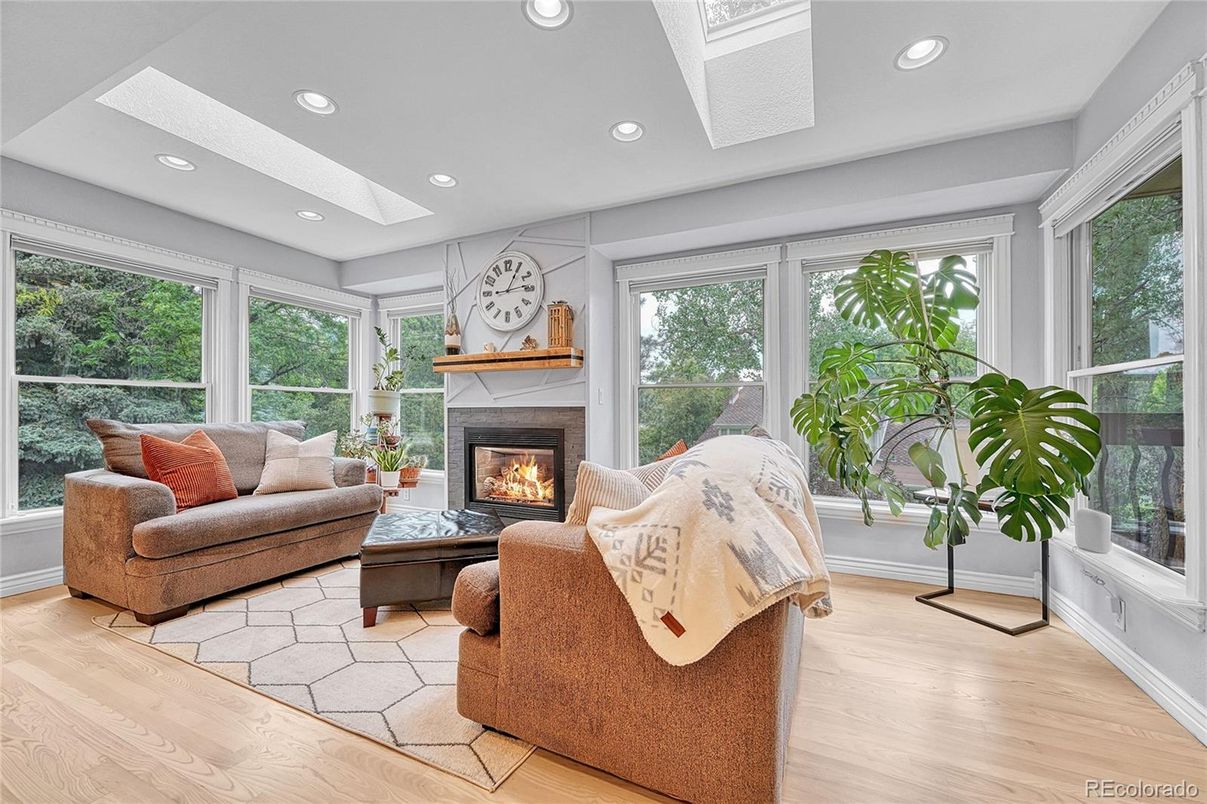 Fireplace, Interior, Living room, Recessed Lighting, Sun Room, Wood Texture Flooring