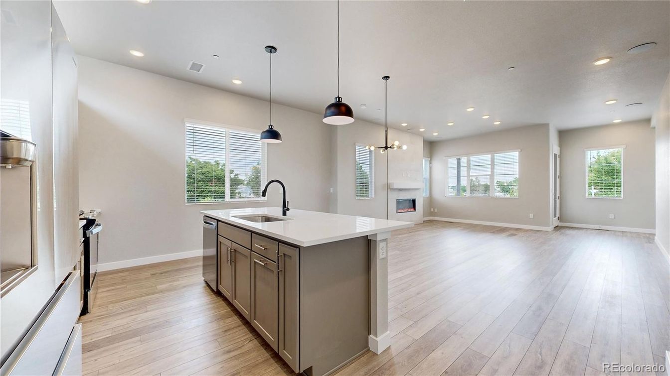 Empty room, Fireplace, Interior, Kitchen, Pendant Lights, Recessed Lighting, Wood Texture Flooring