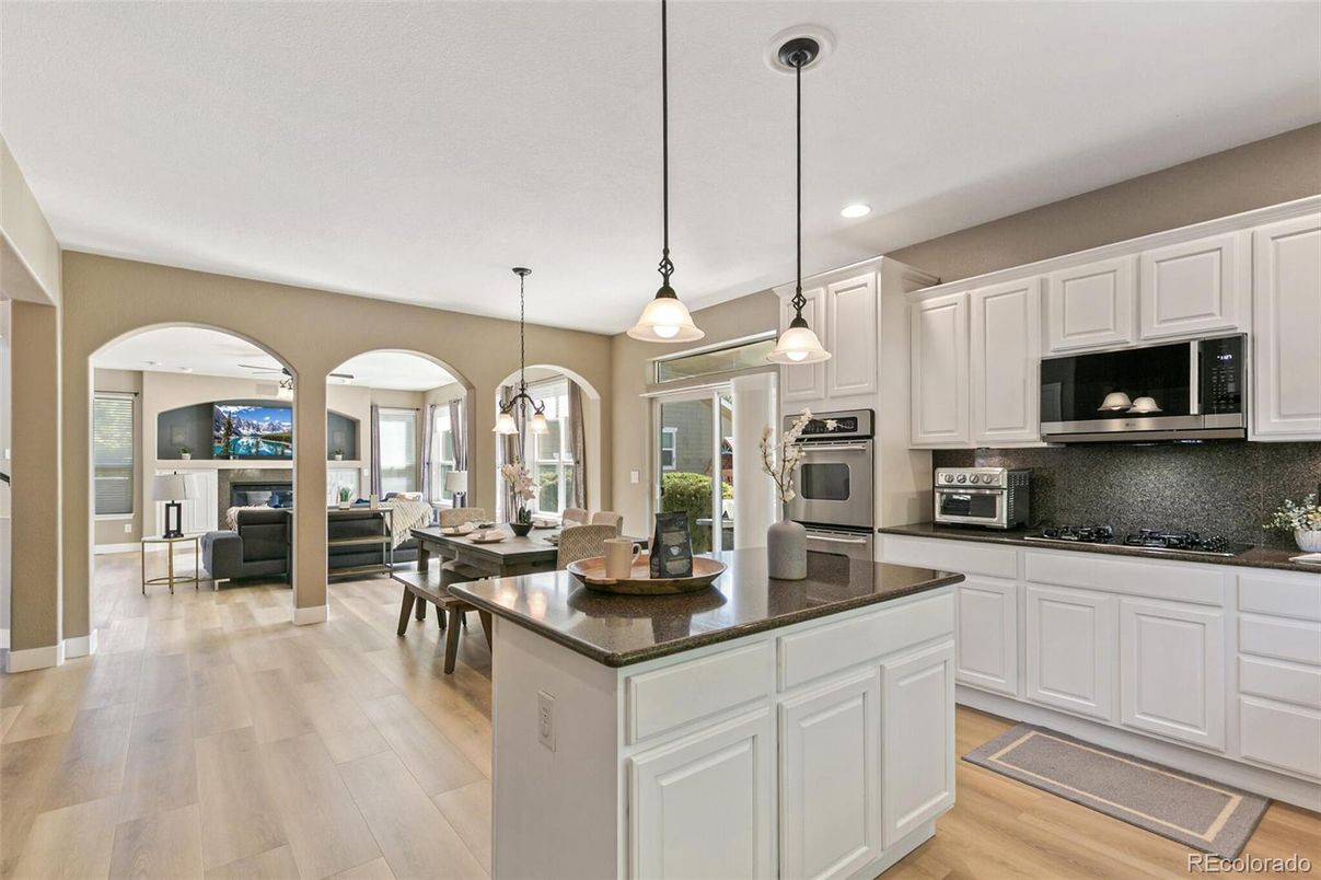 Dining room, Interior, Kitchen, Living room, Pendant Lights, Recessed Lighting, Stainless Steel Appliances, Wood Texture Flooring