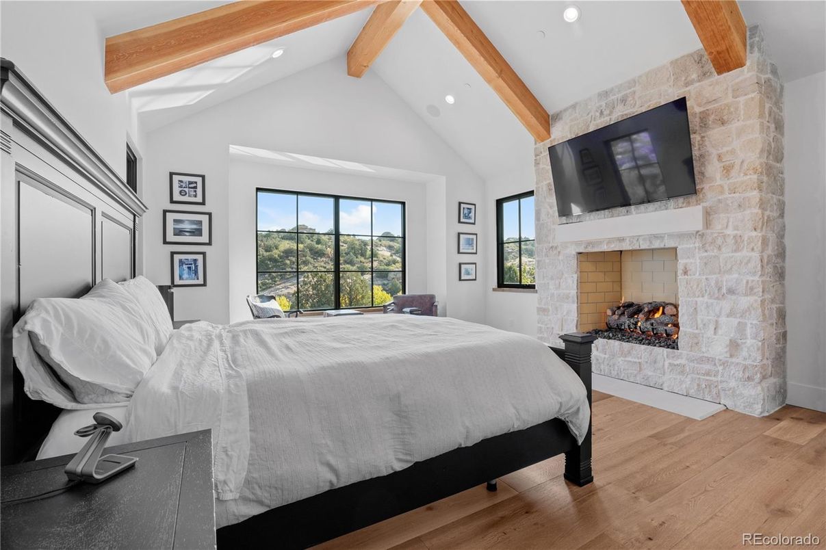 Bedroom, Fireplace, Interior, Recessed Lighting, Stone Walls, Wooden Beams, Wood Texture Flooring