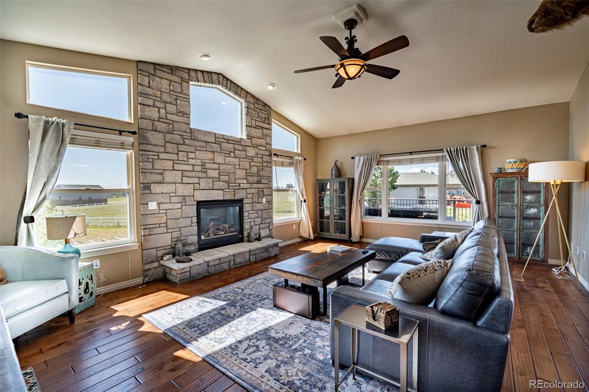 Fireplace, Interior, Living room, Recessed Lighting, Stone Walls, Wood Texture Flooring