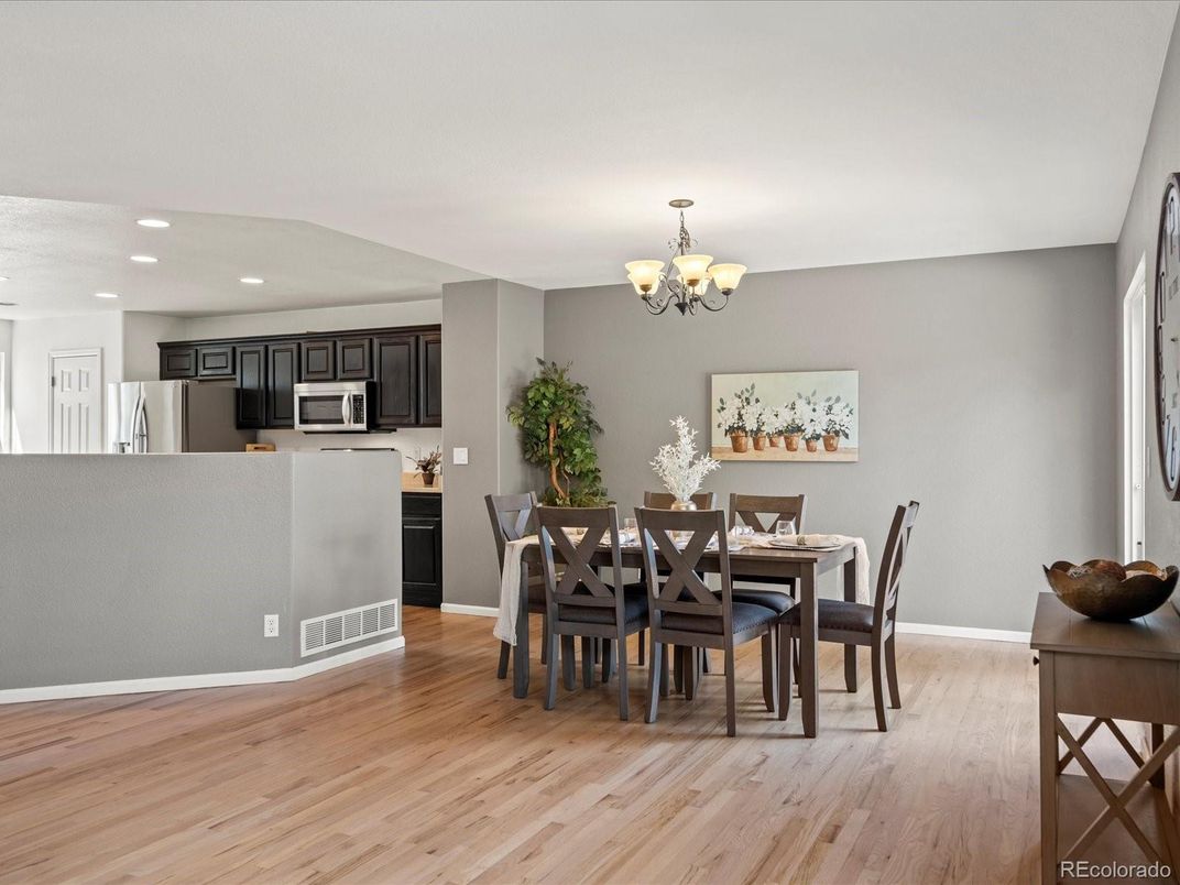 Chandelier, Dining room, Interior, Kitchen, Recessed Lighting, Stainless Steel Appliances, Wood Texture Flooring