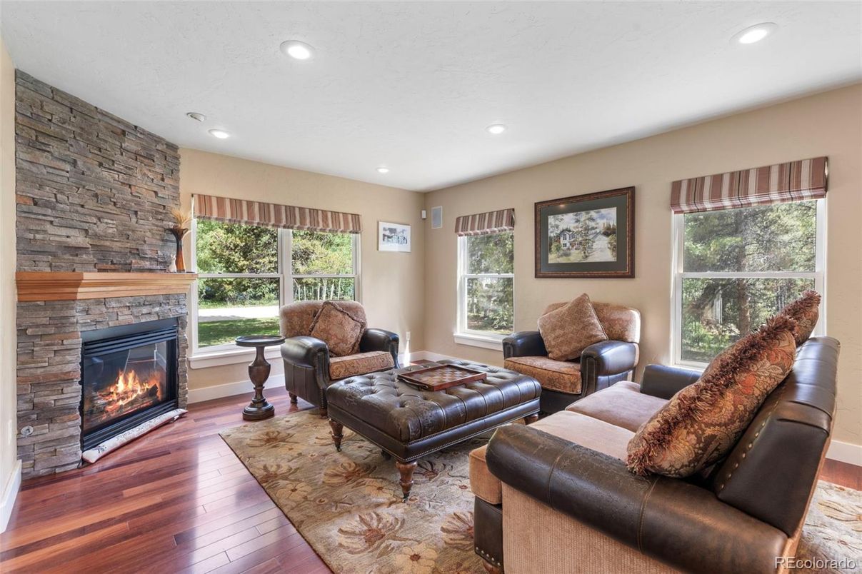Fireplace, Interior, Living room, Recessed Lighting, Stone Walls, Wood Texture Flooring