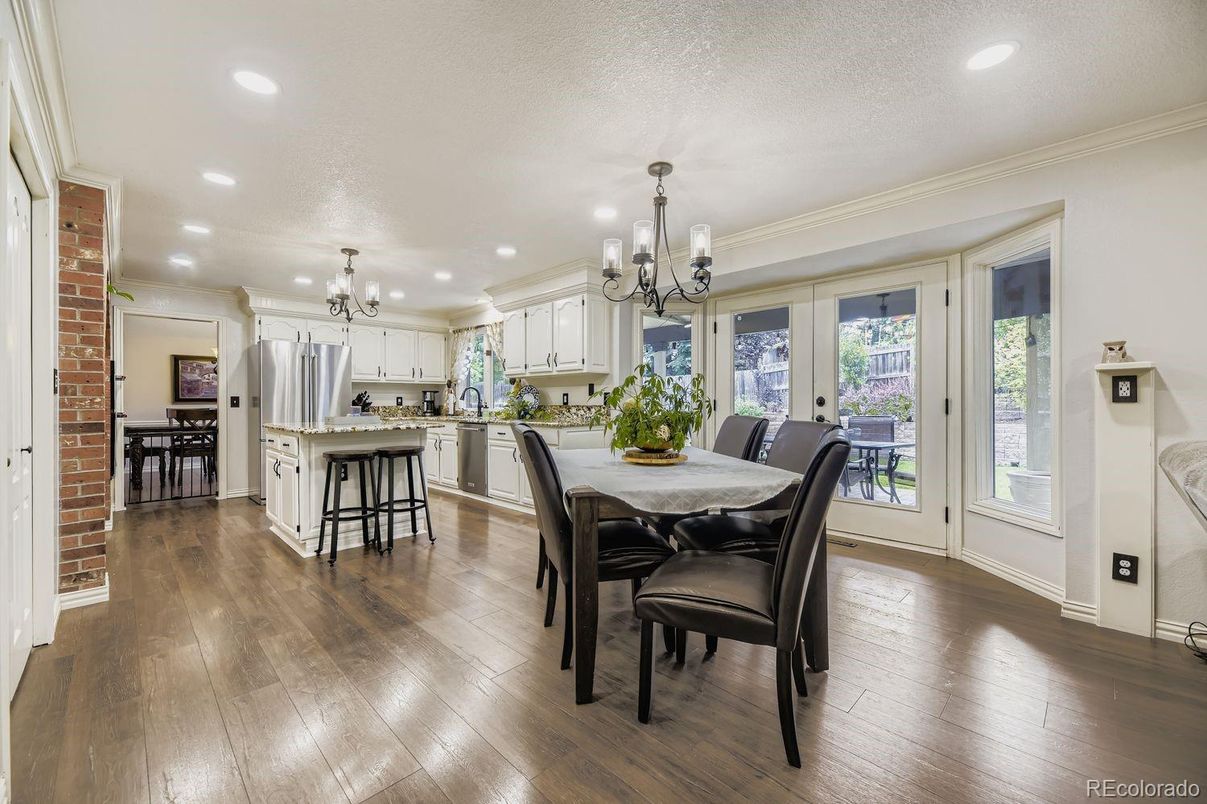 Chandelier, Dining room, Interior, Kitchen, Recessed Lighting, Stainless Steel Appliances, Wood Texture Flooring