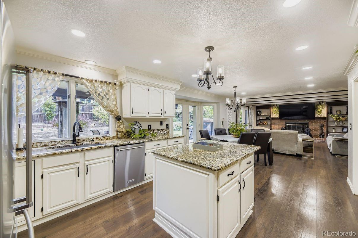 Chandelier, Dining room, Fireplace, Interior, Kitchen, Living room, Recessed Lighting, Wood Texture Flooring