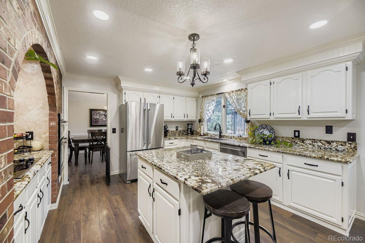 Chandelier, Dining room, Interior, Kitchen, Recessed Lighting, Stainless Steel Appliances, Wood Texture Flooring