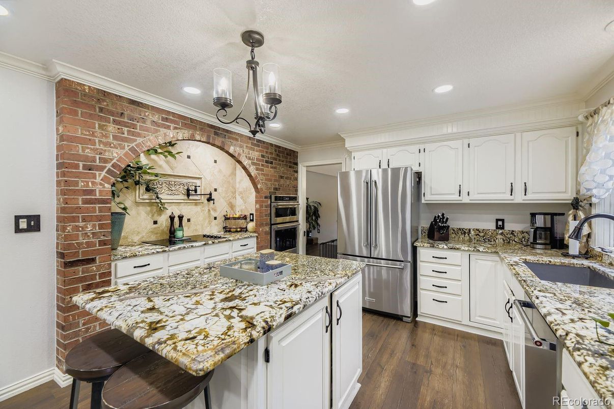 Interior, Kitchen, Pendant Lights, Recessed Lighting, Stainless Steel Appliances, Stone Walls, Wood Texture Flooring