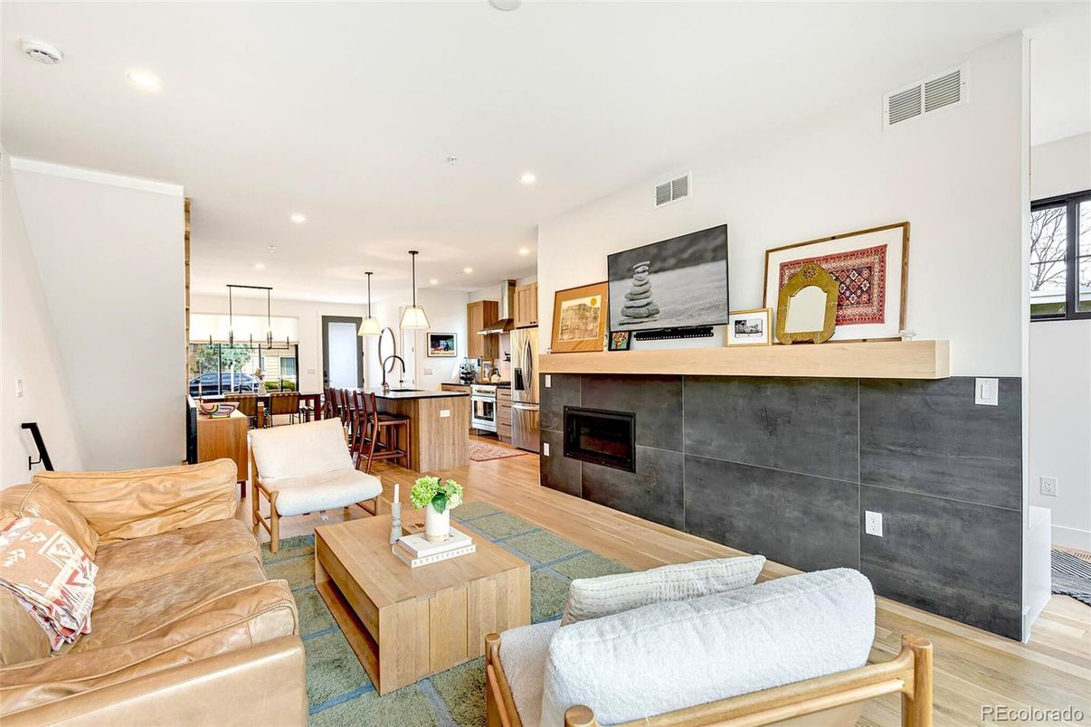 Dining room, Fireplace, Interior, Kitchen, Living room, Pendant Lights, Recessed Lighting, Stainless Steel Appliances, Wood Texture Flooring