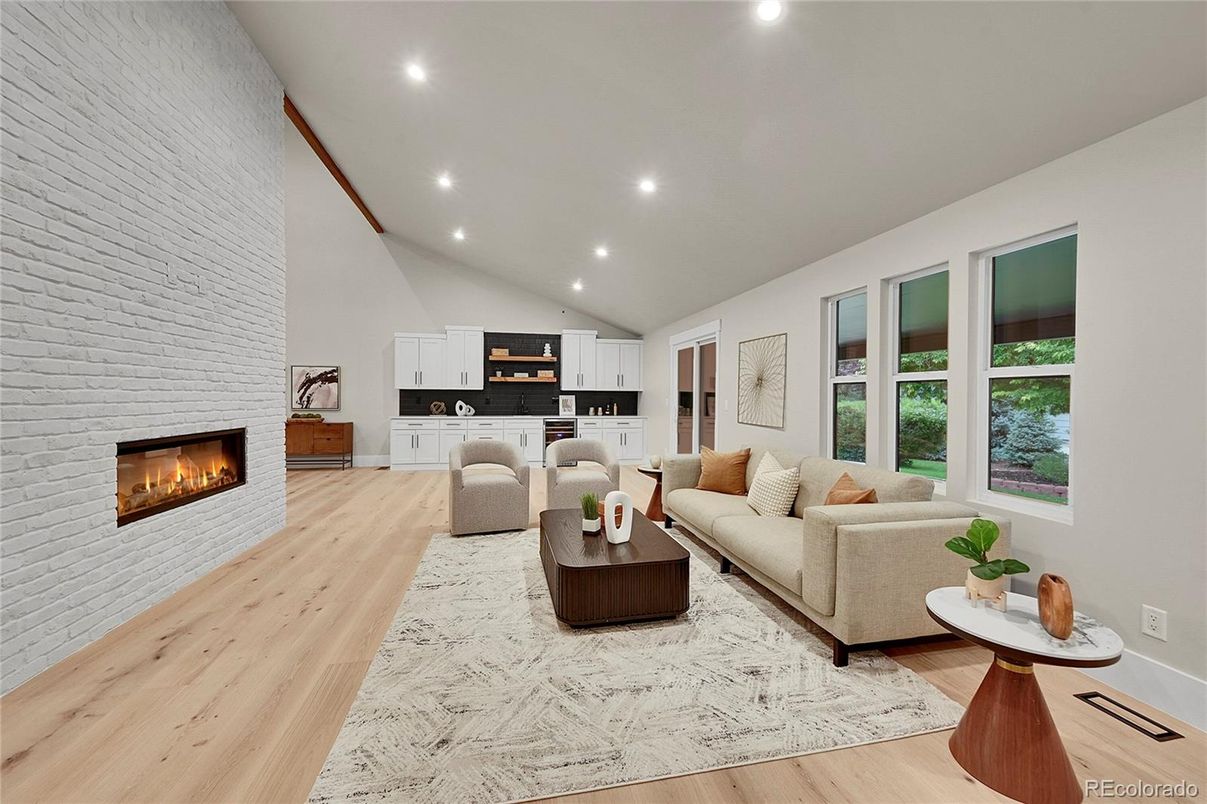 Fireplace, Interior, Living room, Recessed Lighting, Stone Walls, Wood Texture Flooring