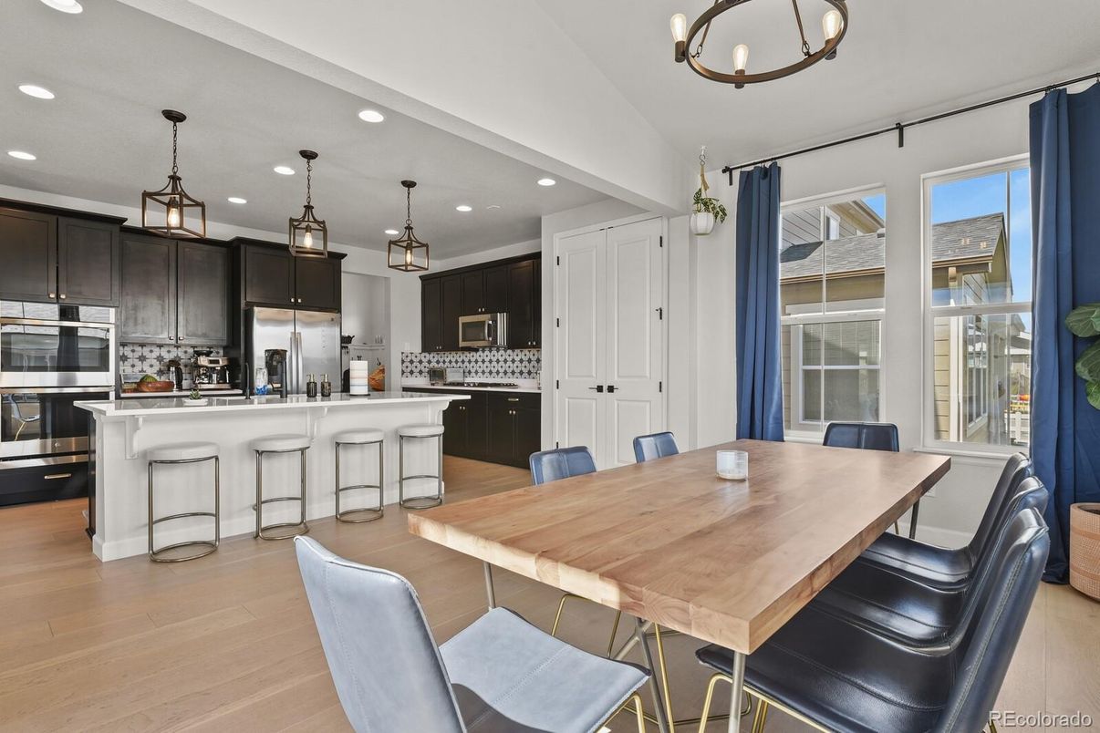 Dining room, Interior, Kitchen, Pendant Lights, Recessed Lighting, Stainless Steel Appliances, Wood Texture Flooring