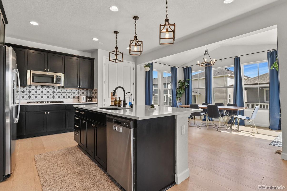 Dining room, Interior, Kitchen, Pendant Lights, Recessed Lighting, Stainless Steel Appliances, Wood Texture Flooring