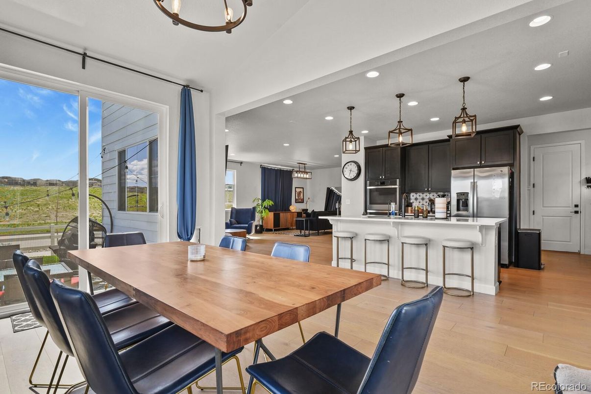 Dining room, Interior, Kitchen, Pendant Lights, Recessed Lighting, Stainless Steel Appliances, Wood Texture Flooring