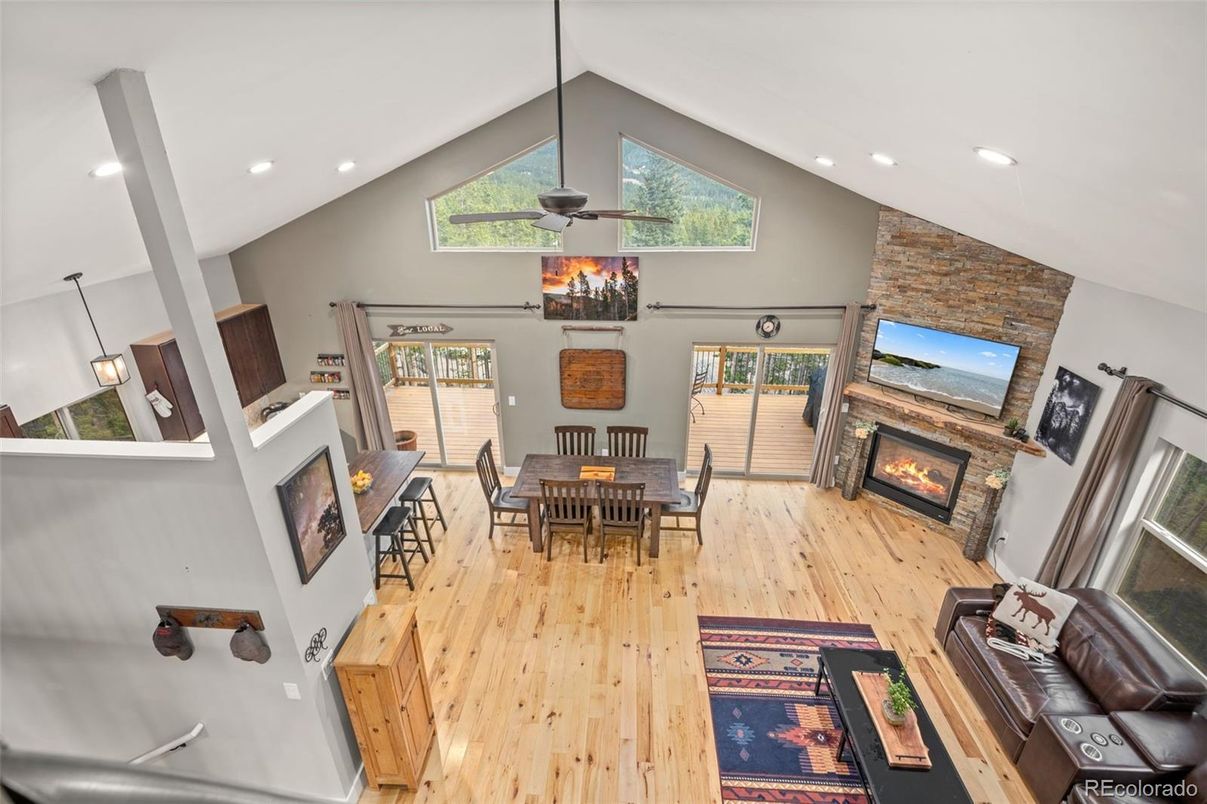 Dining room, Fireplace, Interior, Recessed Lighting, Stone Walls, Wood Texture Flooring
