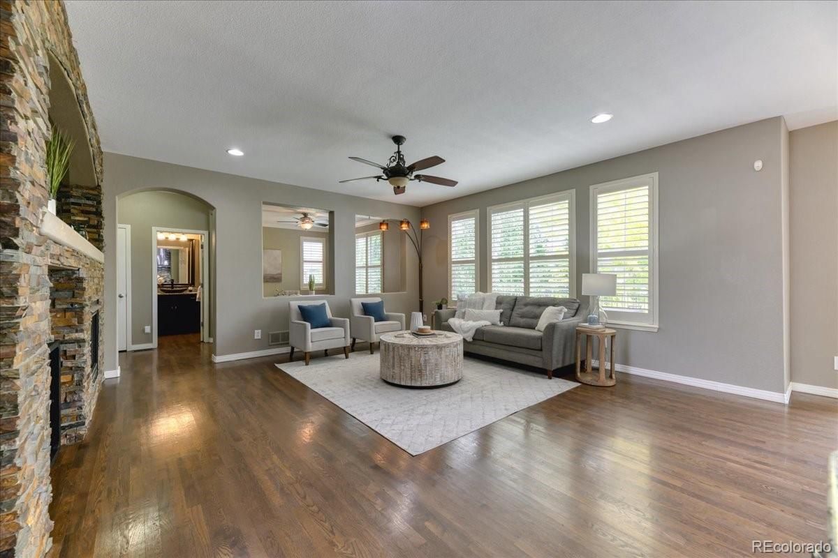 Fireplace, Interior, Living room, Recessed Lighting, Stone Walls, Wood Texture Flooring