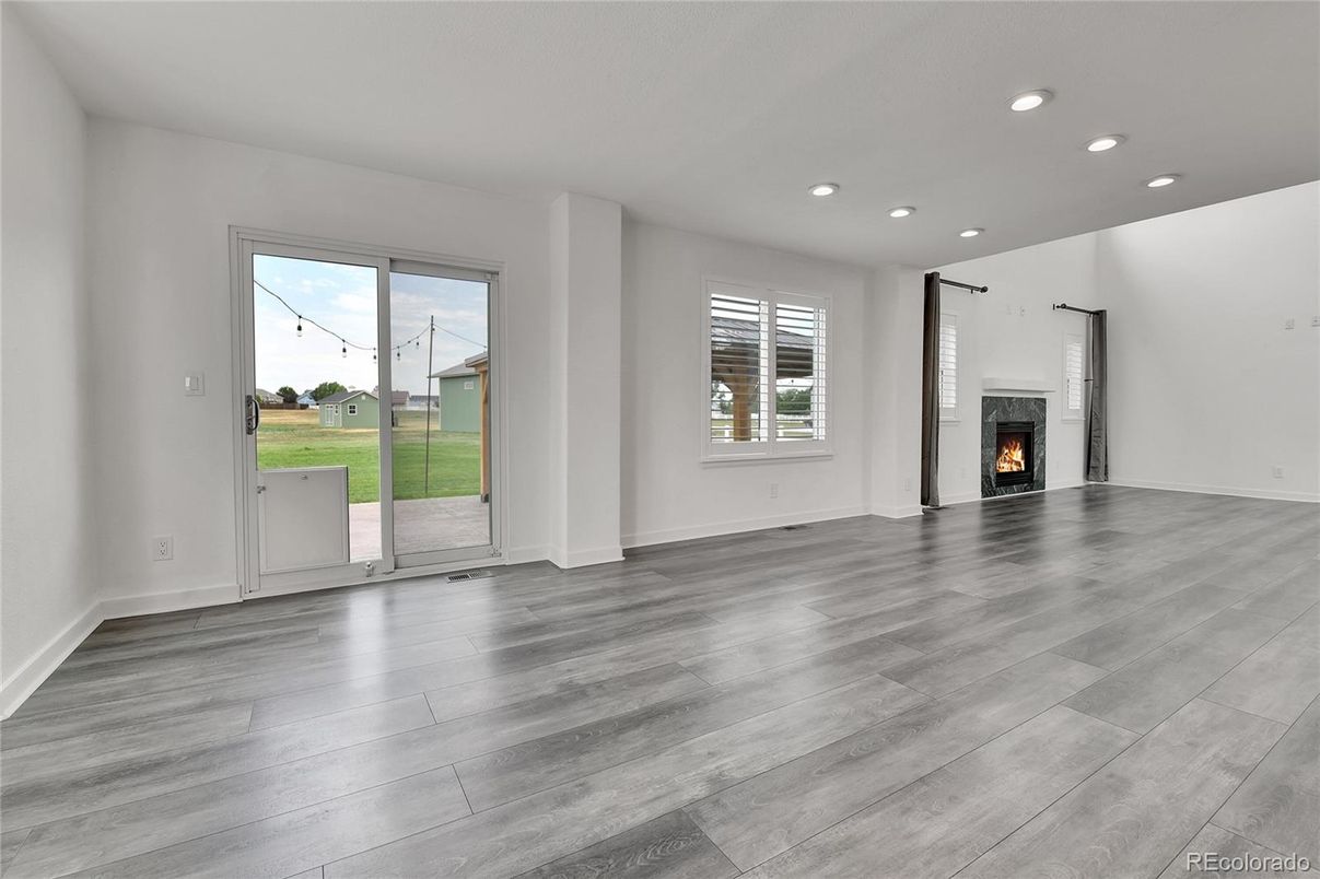 Empty room, Fireplace, Interior, Recessed Lighting, Wood Texture Flooring
