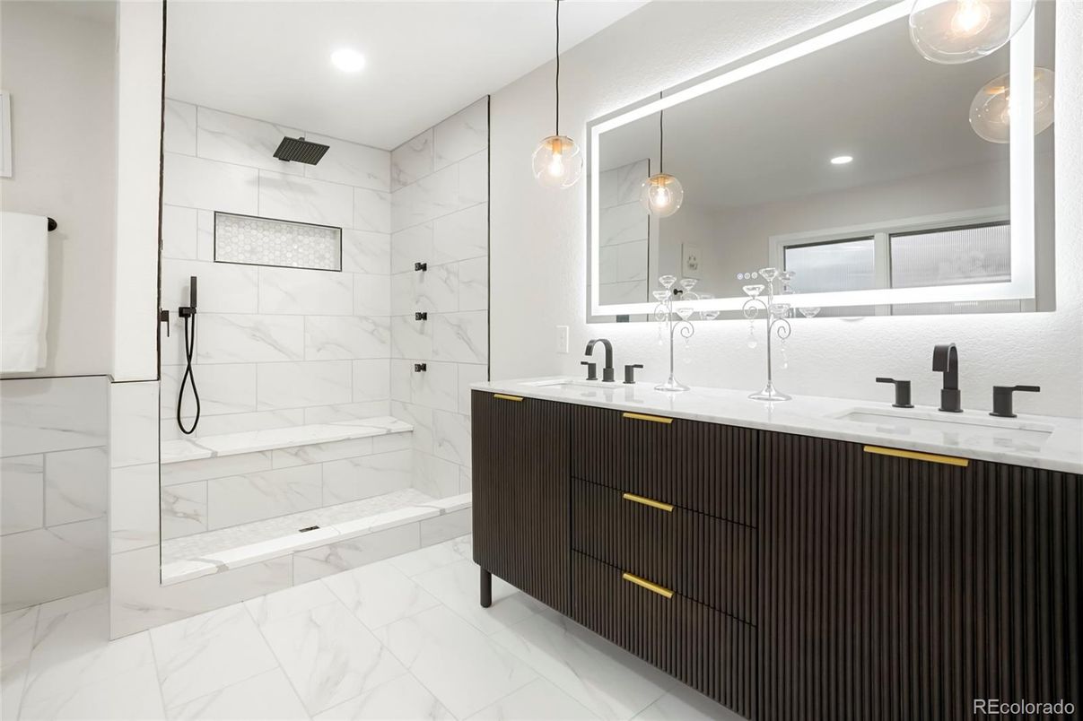 Bathroom, Dual Sink Vanities, Glass Shower, Interior, Marble, Marble Walls, Pendant Lights, Recessed Lighting
