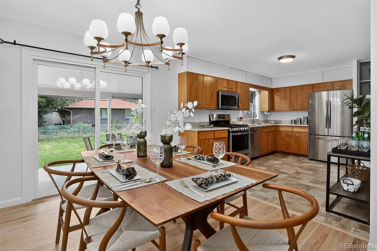 Chandelier, Dining room, Interior, Kitchen, Stainless Steel Appliances, Wood Texture Flooring