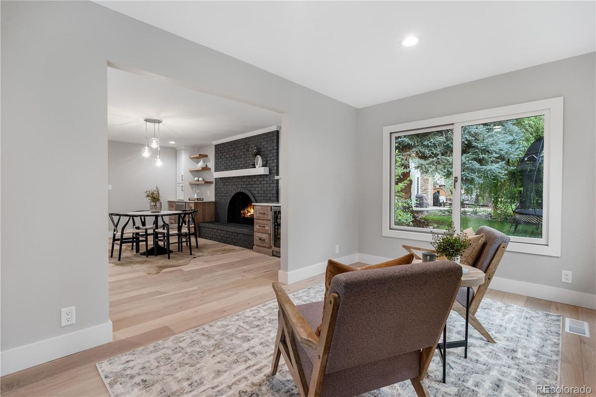 Dining room, Fireplace, Interior, Pendant Lights, Recessed Lighting, Stone Walls, Wood Texture Flooring