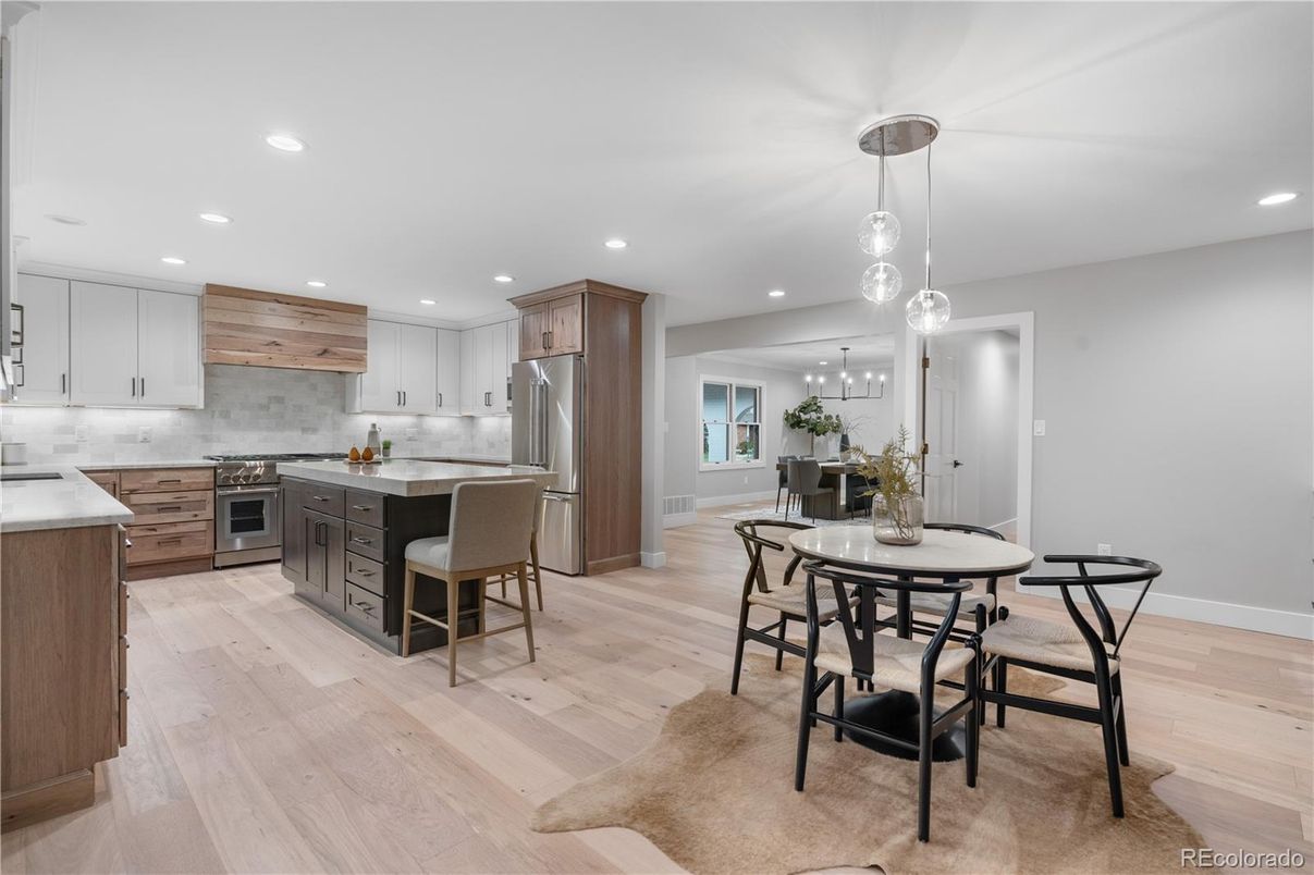 Dining room, Interior, Kitchen, Pendant Lights, Recessed Lighting, Stainless Steel Appliances, Wood Texture Flooring