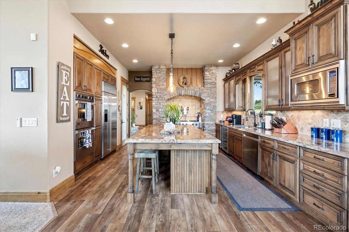 Interior, Kitchen, Pendant Lights, Recessed Lighting, Stainless Steel Appliances, Stone Walls, Wood Texture Flooring