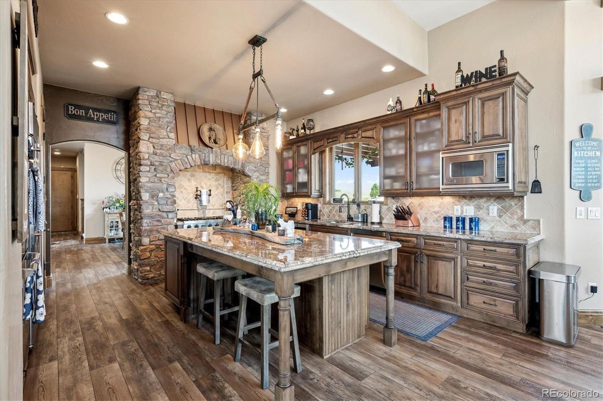 Interior, Kitchen, Pendant Lights, Recessed Lighting, Stainless Steel Appliances, Stone Walls, Wood Texture Flooring