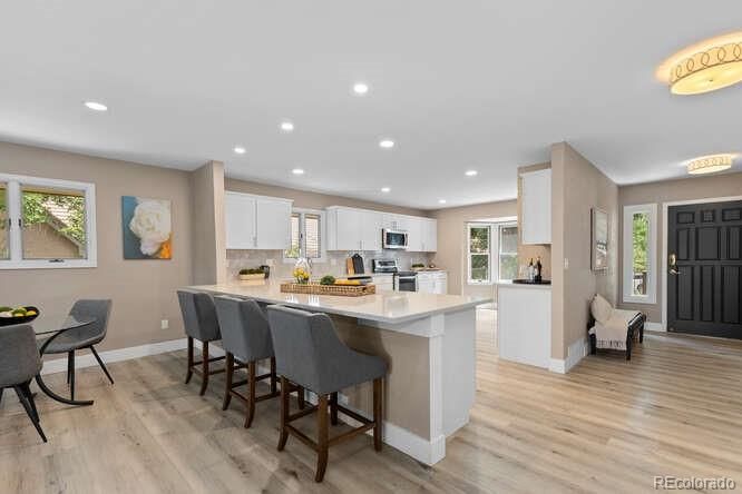 Dining room, Interior, Kitchen, Recessed Lighting, Stainless Steel Appliances, Wood Texture Flooring