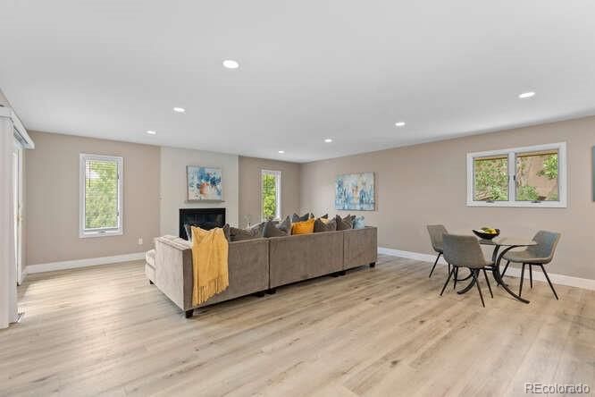 Dining room, Fireplace, Interior, Living room, Recessed Lighting, Wood Texture Flooring
