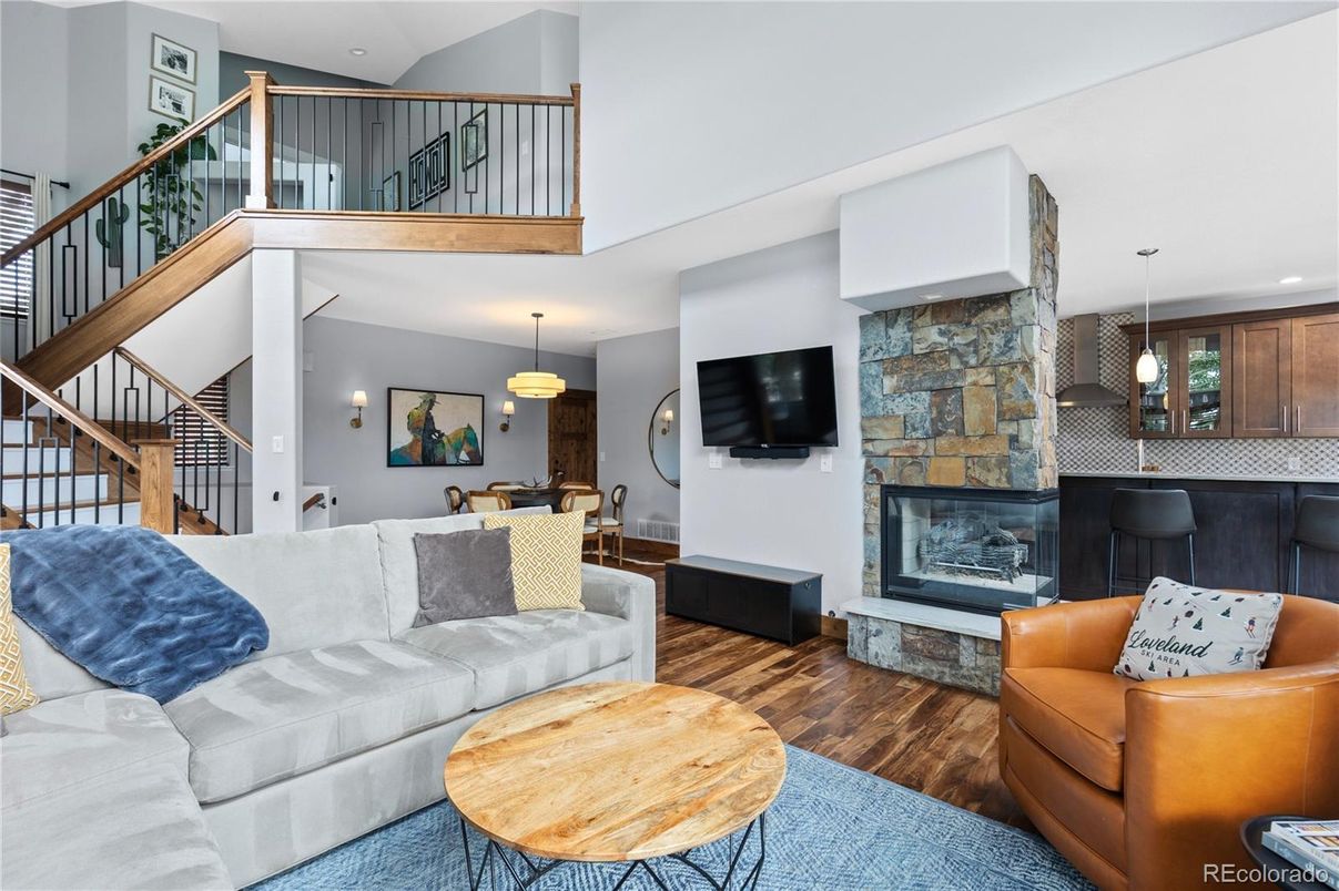 Dining room, Fireplace, Interior, Living room, Pendant Lights, Recessed Lighting, Stone Walls, Wood Texture Flooring